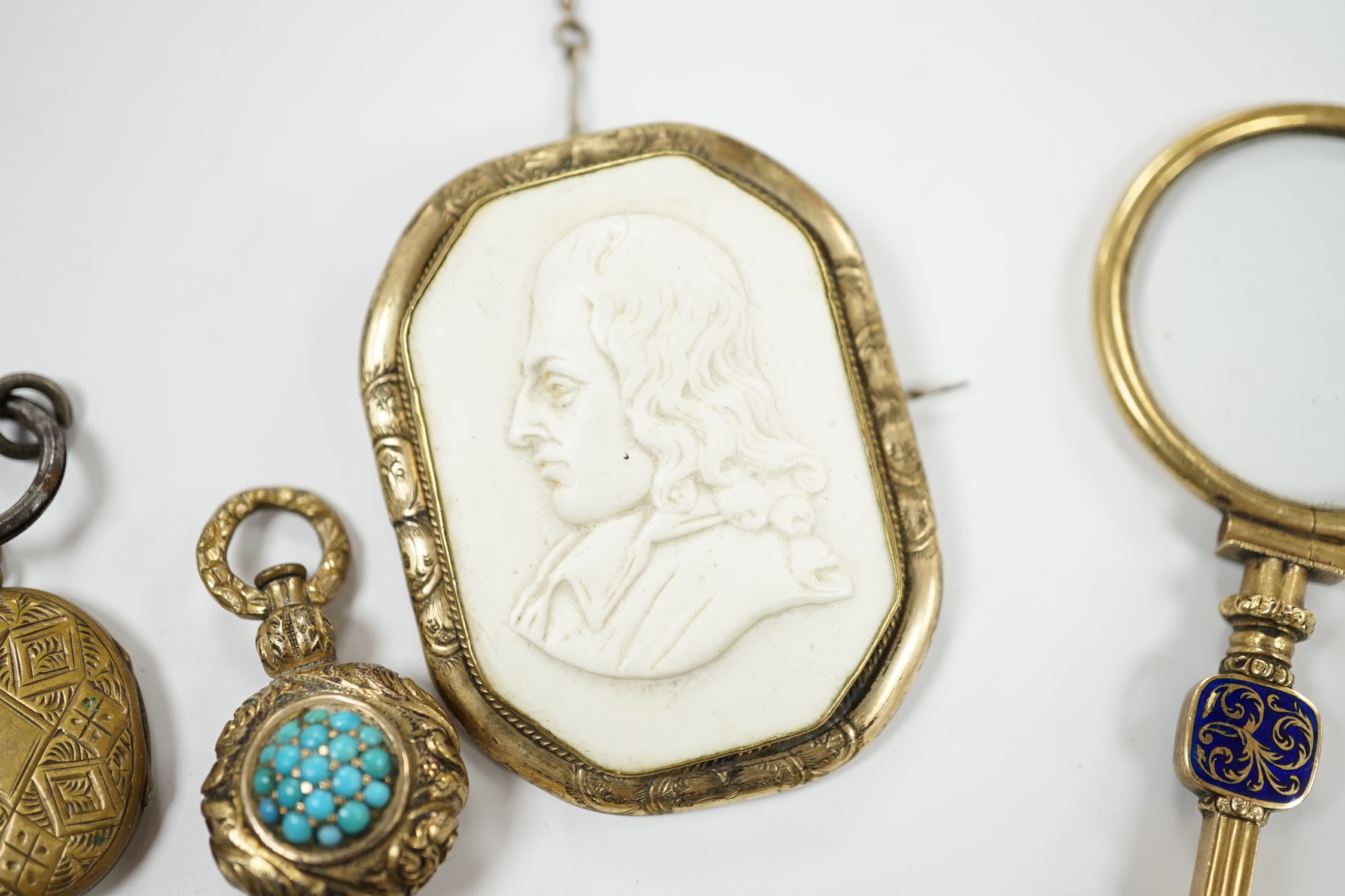 Two Georgian yellow metal mourning brooches, including garnet set and other items including garnet set brooch, watch key, eye glass, paste brooch, etc.